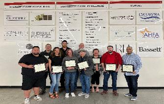 the Supervisory Certification graduating class ast CVCC stands with diplomas during the spring graduation.