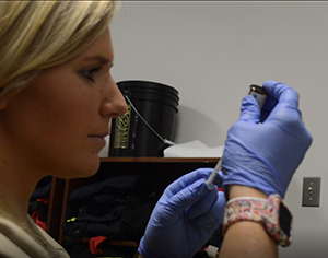 Student Drawing Medication with a needle