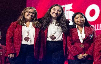 3 CVCC students stand onstage to receive Gold Medals during the National SkillsUSA Conference