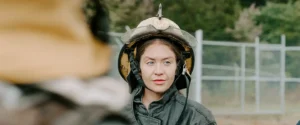 Female firefighter in full training gear at CVCC fire academy.