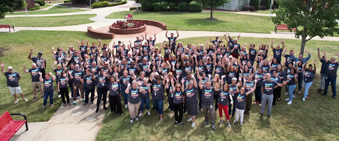 Large group of CVCC faculty and staff posing outdoors.