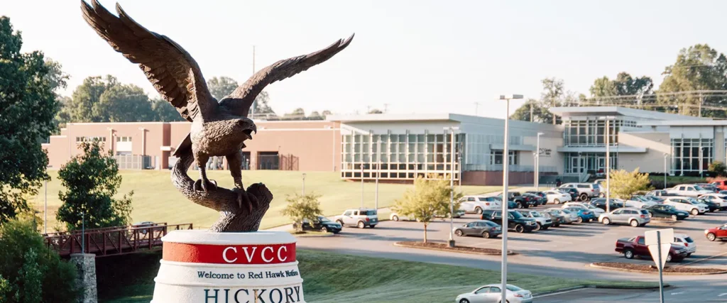 Bronze hawk statue in front of CVCC Hickory campus.