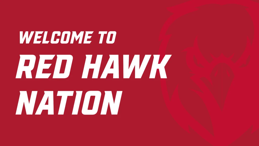 Bold red graphic with the message “Welcome to Red Hawk Nation” in large white text. A faint, stylized image of a red hawk head is visible in the background on the right side, blending with the red background. The design reflects school spirit and branding for Catawba Valley Community College.